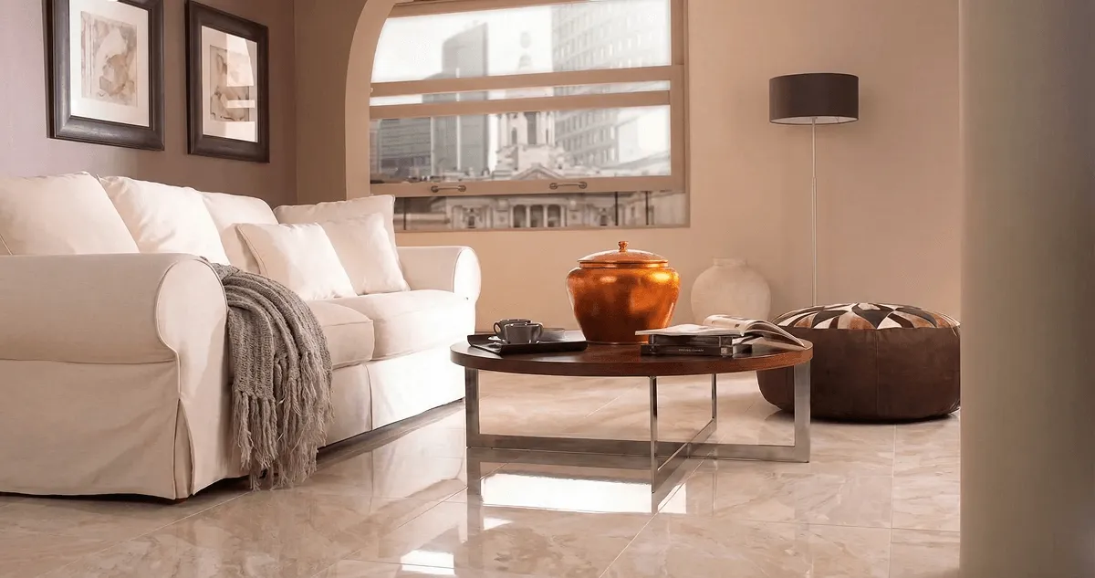 Modern living room with professionally installed marble flooring, a beige sofa, coffee table in Mobile, AL